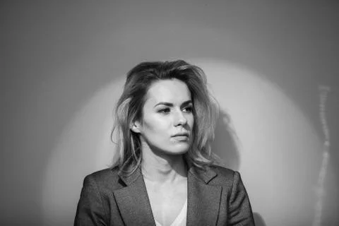 Dramatic black and white portrait of a beautiful woman on a dark background Stock Photos