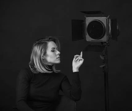 Dramatic black and white portrait of a beautiful woman on a dark background Foto stock