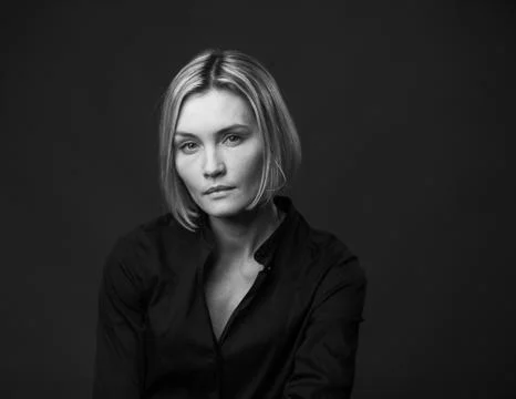 Dramatic black and white portrait of a beautiful woman on a dark background Stock Photos