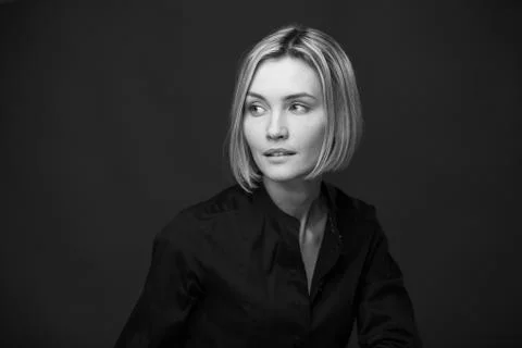 Dramatic black and white portrait of a beautiful woman on a dark background Stock Photos