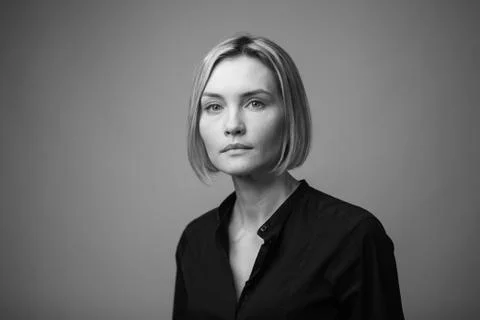Dramatic black and white portrait of a beautiful woman on a dark background Stock Photos