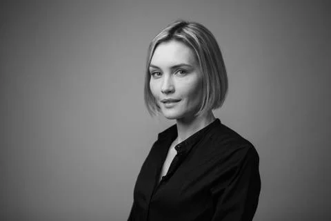 Dramatic black and white portrait of a beautiful woman on a dark background Stock Photos