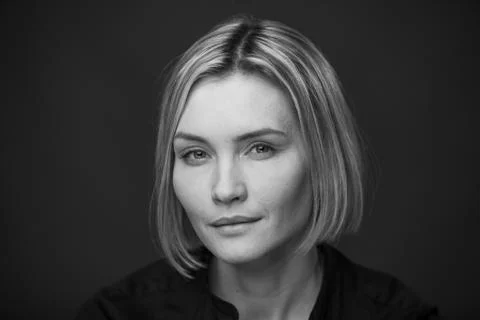 Dramatic black and white portrait of a beautiful woman on a dark background Stock Photos