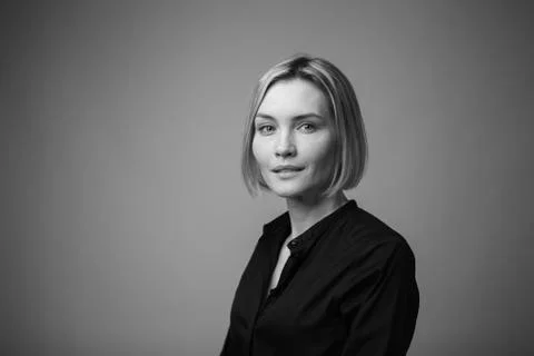 Dramatic black and white portrait of a beautiful woman on a dark background Stock Photos