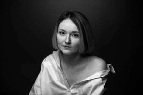 Dramatic black and white portrait of a beautiful woman on a dark background Stock Photos