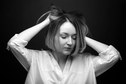 Dramatic black and white portrait of a beautiful woman on a dark background Foto stock