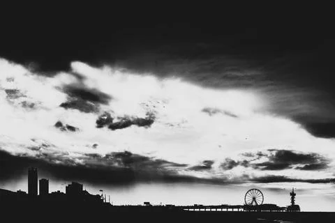 Dramatic black and white shot of the pier in Scheveningen the netherlands. Stock Photos
