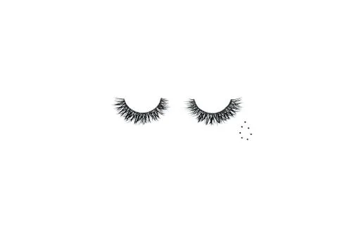 Dramatic black long false eyelashes placed in the shape of a human eye decora Stock Photos