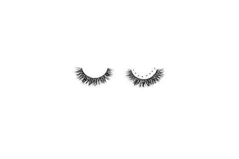 Dramatic black long false eyelashes decorated with bright sparkling golden gl Foto stock