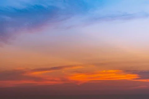 Dramatic blue and orange sky and clouds abstract background. Red-orange cloud Stock Photos