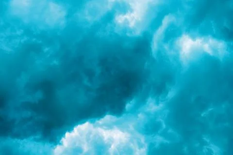 Dramatic blue cloudscape with swirling patterns Stock Photos