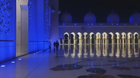 Dramatic blue night lighting on marble walls of Sheikh Zayed Grand Mosque Stock Footage 339763694