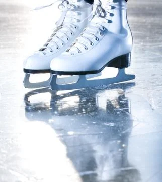 Dramatic blue portrait shot of ice skates Stock Photos