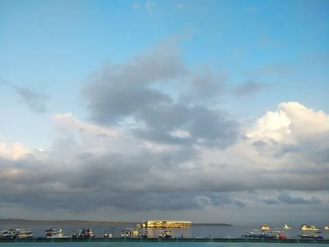 Dramatic blue sky above ocean Stock Photos