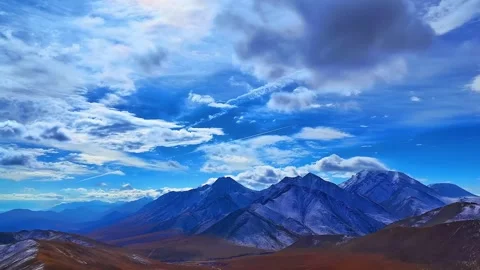 Dramatic Blue Sky and Clouds Over Snow Dusted Qilian Mountains Qinghai-Tibet Stock Footage 339269812