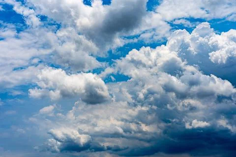 Dramatic blue sky and stratocumulus white clouds for backgrounds Stock Photos