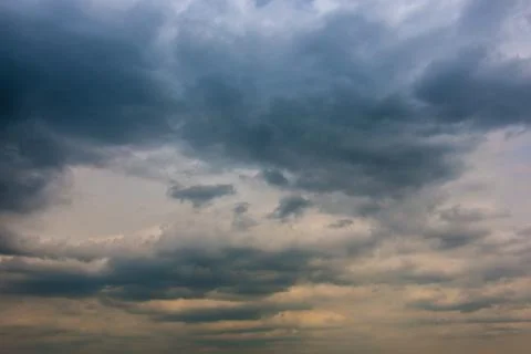 Dramatic blue sky and white and gray clouds Stock Photos