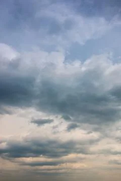 Dramatic blue sky and white and gray clouds Stock Photos