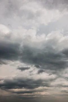 Dramatic blue sky and white and gray clouds Stock Photos