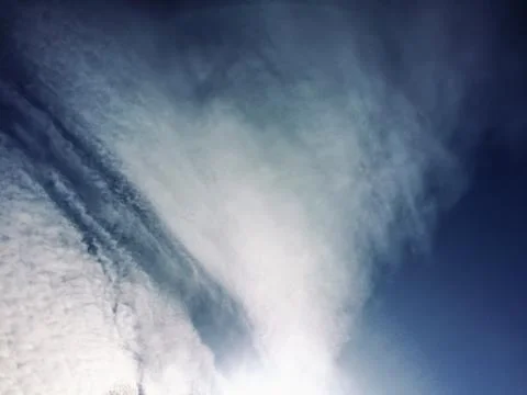 Dramatic blue sky with clouds and sun rays Stock Photos