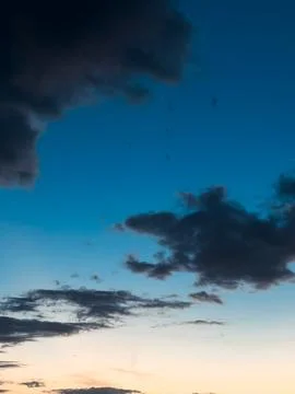 Dramatic Blue Sky With Clouds at Sunset Stock Photos