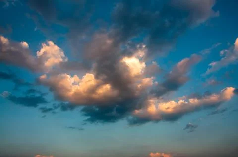 Dramatic blue sky with colorful clouds Stock Photos