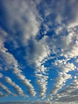 Dramatic Blue Sky Filled with White Streaks of Altocumulus Clouds Stock Photos