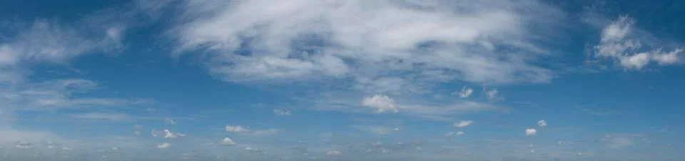 Dramatic blue sky with fluffy clouds texture background.panorama Stock Photos