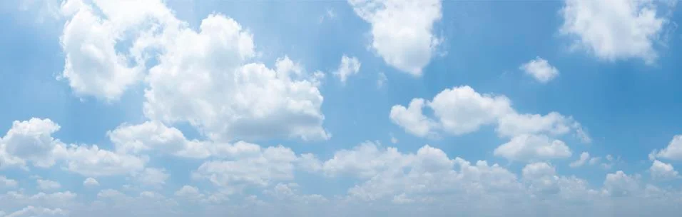 Dramatic blue sky with fluffy clouds texture background. panorama Stock Photos