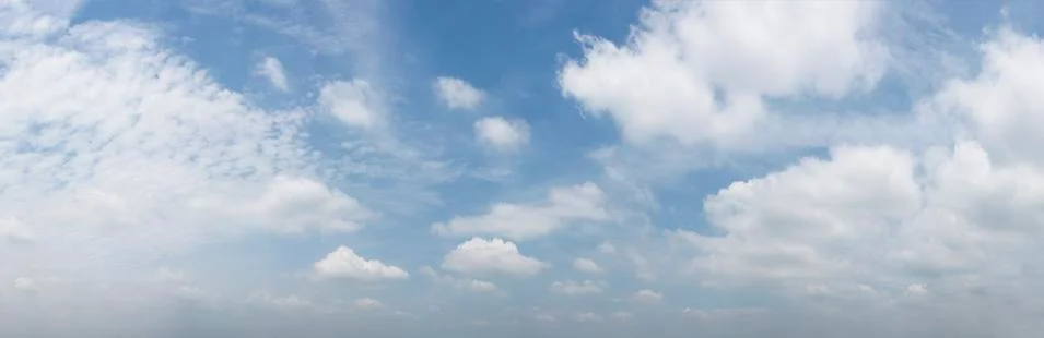 Dramatic blue sky with fluffy clouds texture background.panorama Stock Photos