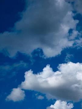 Dramatic Blue Sky Full of White Cumulus Clouds Formation Background Stock Photos