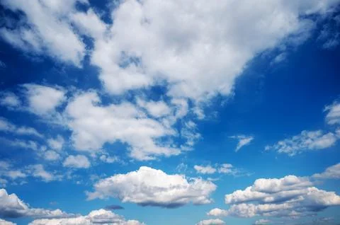Dramatic blue sky with layered fluffy white clouds Photos