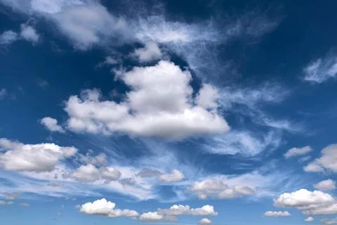 Dramatic Blue Sky With Layered White Clouds Stock Photos