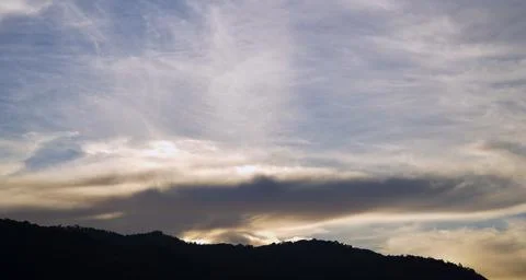 Dramatic Blue Sky with Soft White Clouds at Sunset 스톡 사진