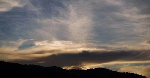 Dramatic Blue Sky with Soft White Clouds at Sunset 스톡 사진