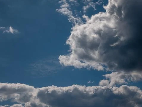 Dramatic blue sky with towering clouds Stock Photos