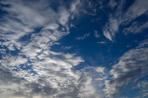 Dramatic blue sky with white fluffy clouds background Stock Photos