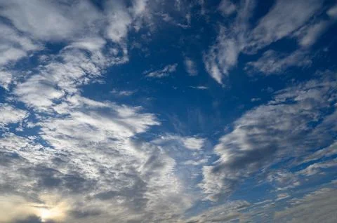 Dramatic blue sky with white fluffy clouds background Stock Photos