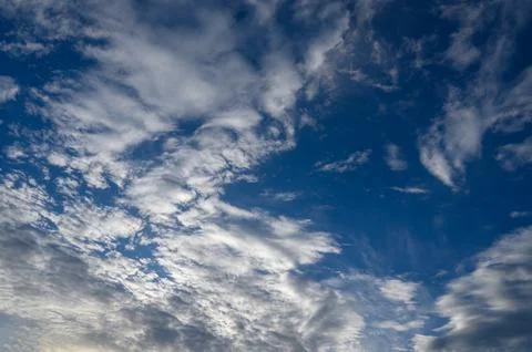 Dramatic blue sky with white fluffy clouds background Stock Photos