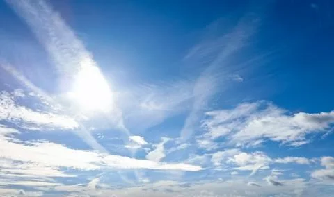 Dramatic Blue Sky with Wispy Cirrus Clouds and White Cloudscape Stock Photos