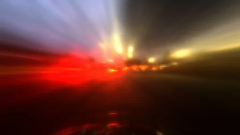 Dramatic blurred glowing streaks of light illuminate POV city driving Stock Footage 97853982
