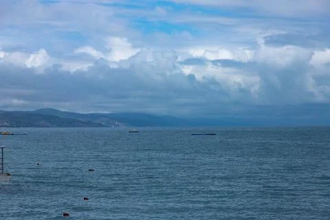 Dramatic blurred mountain landscape on the Black Sea beach, landscape with cl Stock Photos