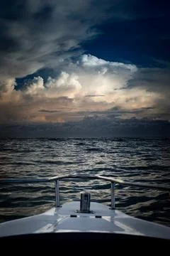 Dramatic Boat POV with Stormy Cloudscape Over the Sea Stock Photos