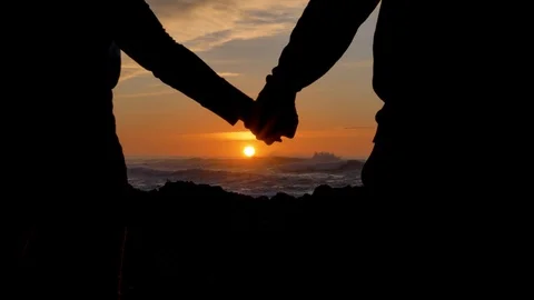 Dramatic break up Couple separating their hands at sunset, love story ending Stock Footage 123968601