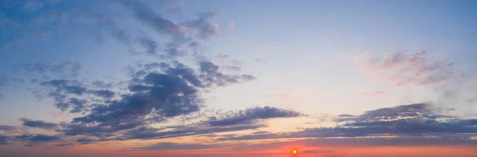 Dramatic bright saturated sunset or sunrise in red-purple hues with single cl Photos