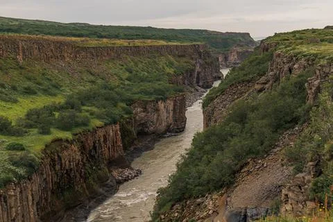 Dramatic Canyon with River and Basalt Cliffs in Iceland Stock Photos