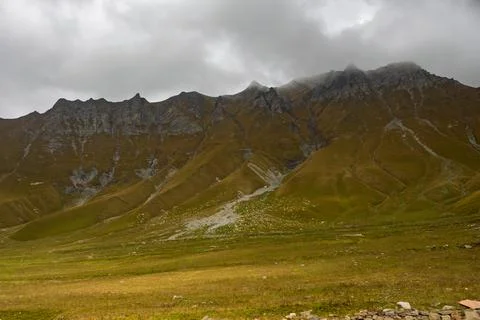 Dramatic Caucasus Mountain Landscape With Misty Rugged Ridge Stock Photos
