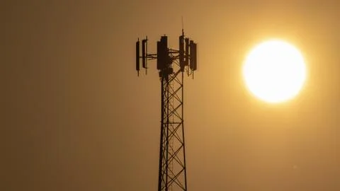 Dramatic Cell Tower Sunrise. Stock Photos