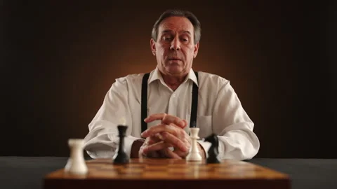 Dramatic Chess Endgame Mans Strategic Move in Brown-Backlit Setting Scene Stock Footage 260720402