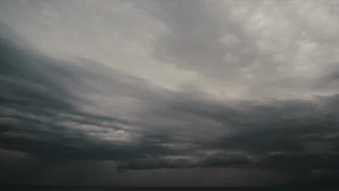 Dramatic cinematic clouds time lapse. Dark overcast sky, with stormy clouds over Stock Footage 171807935